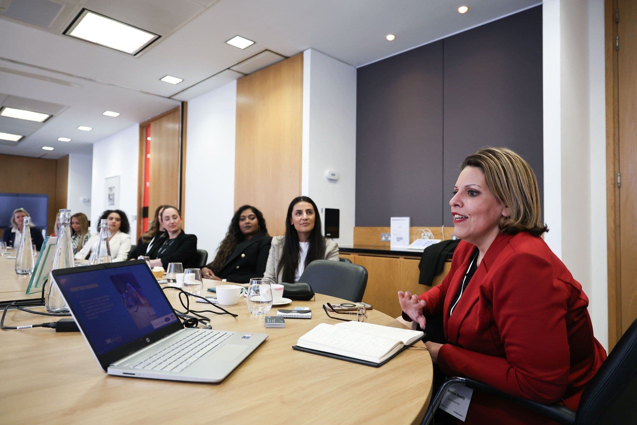 A speaker mid-sentence at the SHEspeaks launch roundtable, JLL London, 29 April 2025.